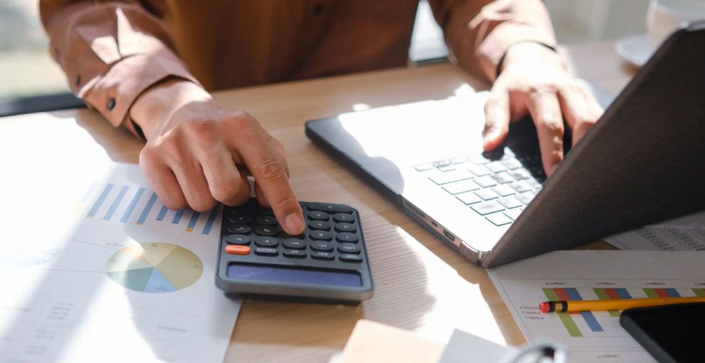 Detailed Swiss payroll simulation document on tablet showing itemized breakdown of AVS, LPP, LAA deductions and canton tax from gross to net salary in CHF